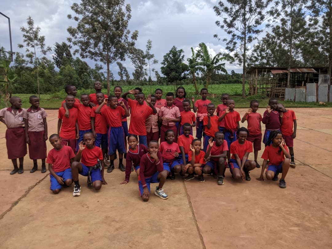 Happy children benefit4ing from sponsorship